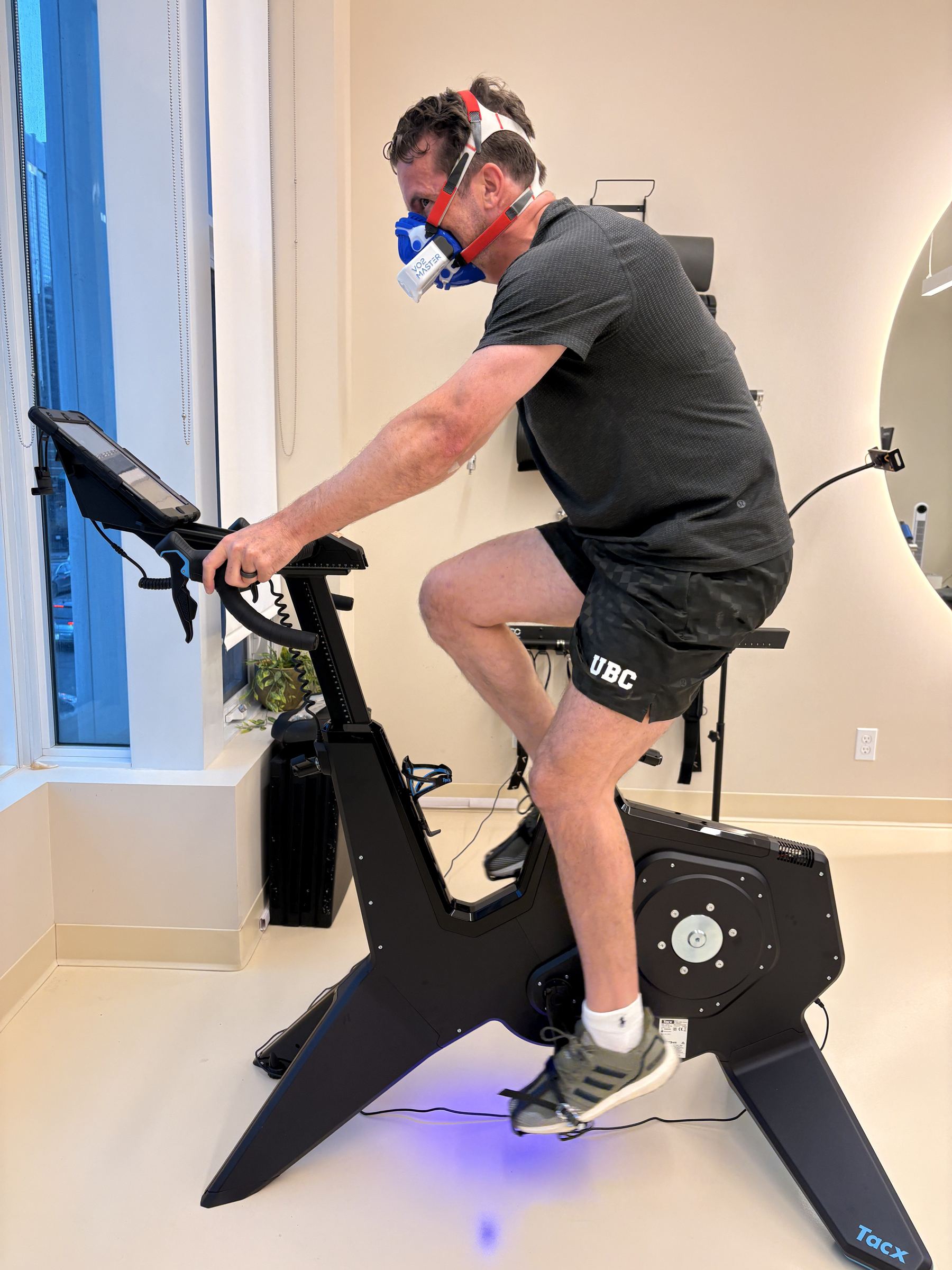 Man doing a VO2 max test on a bike at Aeon Future Health in Calgary
